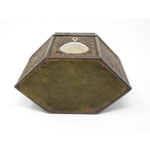 336 - A Georgian mahogany and rolled paper Tea Caddy of hexagonal form with circular convex glass covered ... 