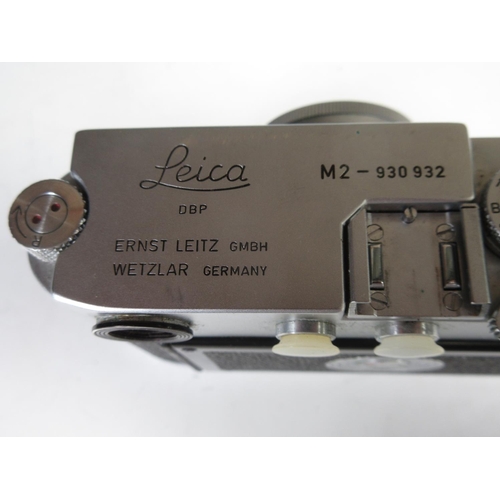 341 - A Leica M2 Rangefinder Camera, C.1958, No. 930 932, with f2/2.8 Elmar lens, No.1551843, and a Leica ... 