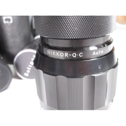 344 - A Nikon Camera Auto 4/200mm Zoom Lens in case, A Soligor Lens, a filter hood for a Hassleblad and si... 