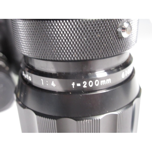 344 - A Nikon Camera Auto 4/200mm Zoom Lens in case, A Soligor Lens, a filter hood for a Hassleblad and si... 