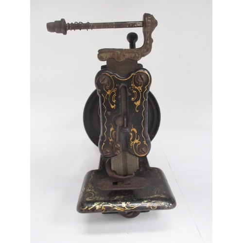 352 - A mid 19th Century cast iron Sewing Machine by James Weir, painted spray of flowers and with gilt de... 