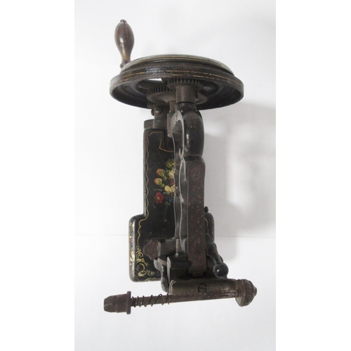 352 - A mid 19th Century cast iron Sewing Machine by James Weir, painted spray of flowers and with gilt de... 