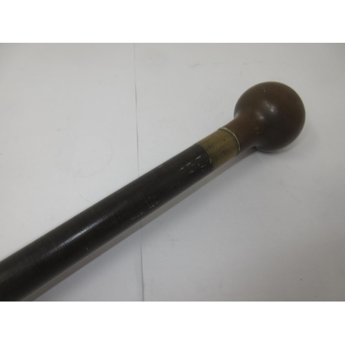 355 - A heavy brass mounted Swagger Stick made of numerous small discs, possibly leather, with horn-type k... 