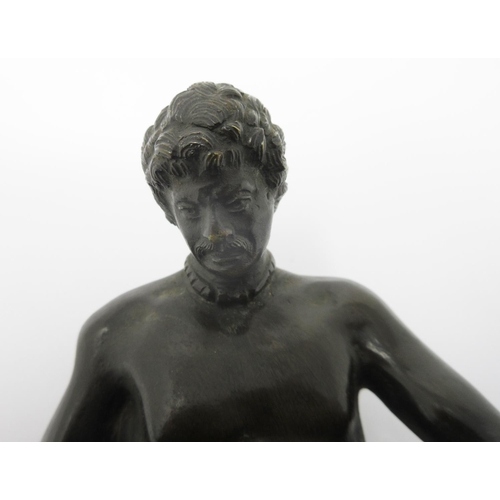 363 - A bronze seated Figure of a naked gladiator with a wound to his chest on an oval marble base, 6 1/2i... 