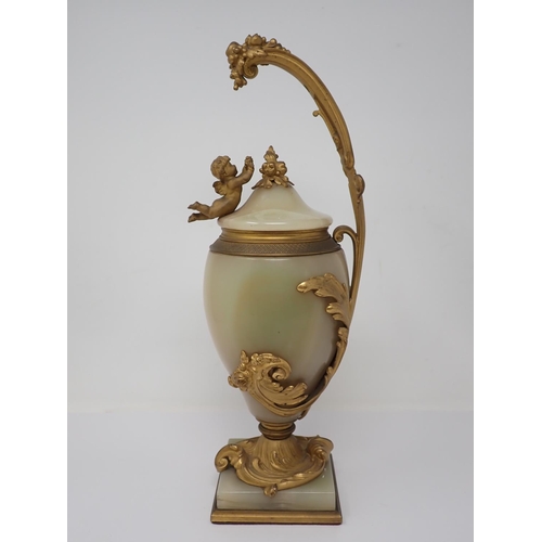 364 - A marble and gilded bronze Vase and Cover, the cover mounted with a cherub reaching for a grapevine,... 