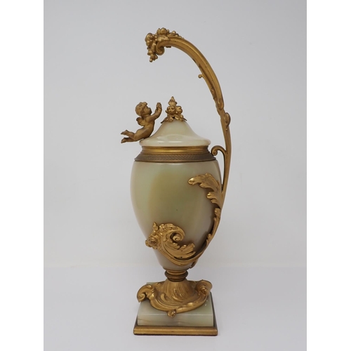 364 - A marble and gilded bronze Vase and Cover, the cover mounted with a cherub reaching for a grapevine,... 