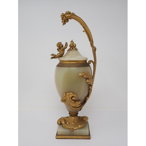 364 - A marble and gilded bronze Vase and Cover, the cover mounted with a cherub reaching for a grapevine,... 