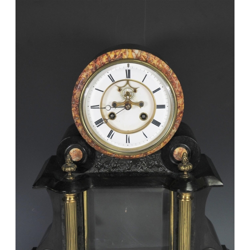 380 - A black slate Empire style Mantel Clock by Duplan & Salles with embossed panels depicting Putti and ... 