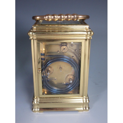 383 - A brass cased Grand Sonnerie Carriage Clock inscribed No.985 to underside within fitted leather case... 