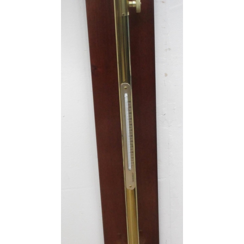 385 - A brass maritime Barometer and Thermometer by F. Darton & Co, London 1940 on mahogany mount 3ft 8in ... 