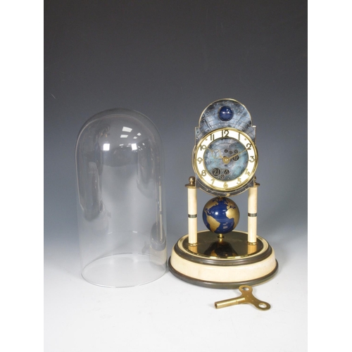 386 - A Kaiser Universe moon phase torsion Clock with circular dial, globe pendulum under glass dome, 10 1... 