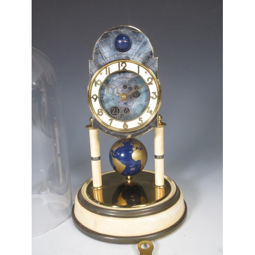 386 - A Kaiser Universe moon phase torsion Clock with circular dial, globe pendulum under glass dome, 10 1... 