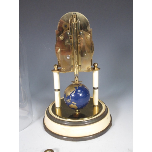 386 - A Kaiser Universe moon phase torsion Clock with circular dial, globe pendulum under glass dome, 10 1... 