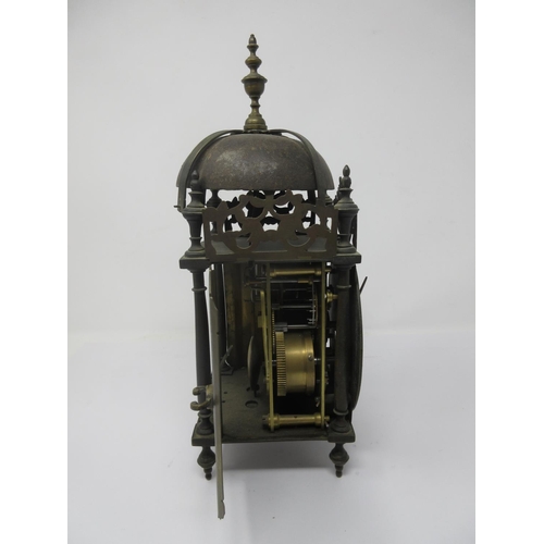 387 - An 18th Century style Lantern Clock with later movement, brass chapter ring and striking on a bell, ... 