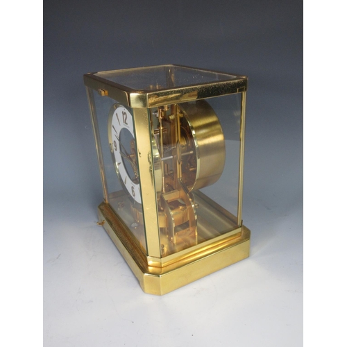 398 - A Jaeger Le Coultre Atmos Clock in brass and glazed case, numbered 445406 9 1/2in H x 8in W