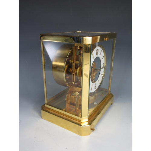 398 - A Jaeger Le Coultre Atmos Clock in brass and glazed case, numbered 445406 9 1/2in H x 8in W