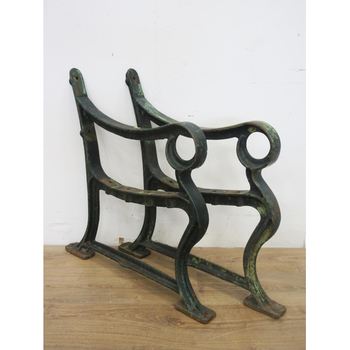 405 - A pair of cast metal garden bench ends