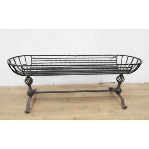 406 - A wrought iron Garden Trough with cheval frame having spiral supports, 5ft 2in