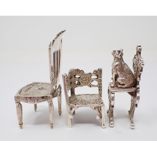 42 - A Victorian Continental silver miniature shield back Chair. Import mark London 1892, another Chair w... 