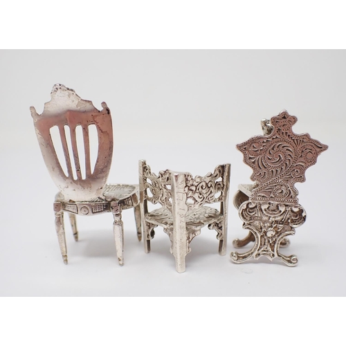 42 - A Victorian Continental silver miniature shield back Chair. Import mark London 1892, another Chair w... 