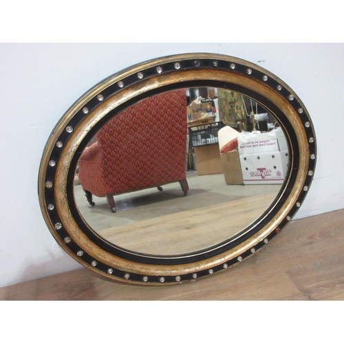 437 - A George III Irish oval Wall Mirror with ebonised and gilt frame inset with cut glass studs, two mis... 