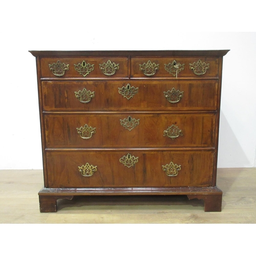 438 - An 18th Century cross-banded walnut Chest of two short and three long drawers on bracket supports, 3... 