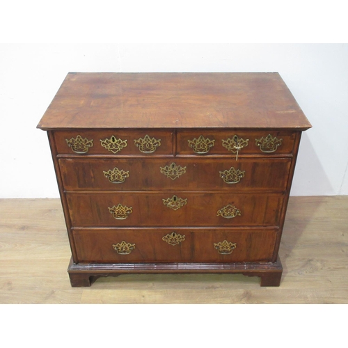 438 - An 18th Century cross-banded walnut Chest of two short and three long drawers on bracket supports, 3... 