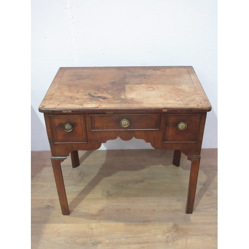 441 - A Georgian walnut Lowboy fitted three drawers with a quarter veneered and crossbanded top, fitted th... 