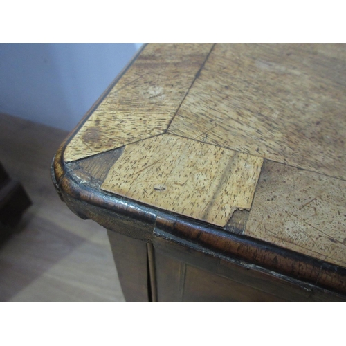 441 - A Georgian walnut Lowboy fitted three drawers with a quarter veneered and crossbanded top, fitted th... 