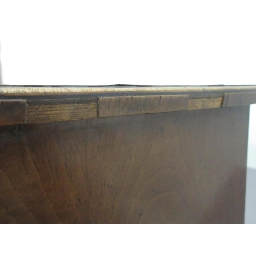 441 - A Georgian walnut Lowboy fitted three drawers with a quarter veneered and crossbanded top, fitted th... 