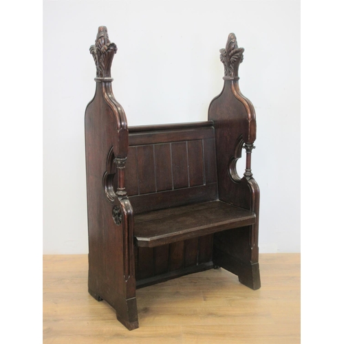 443 - A Victorian oak Pew of narrow proportions with high sides terminated with leafage surmount 4ft 8in H... 