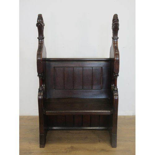 443 - A Victorian oak Pew of narrow proportions with high sides terminated with leafage surmount 4ft 8in H... 