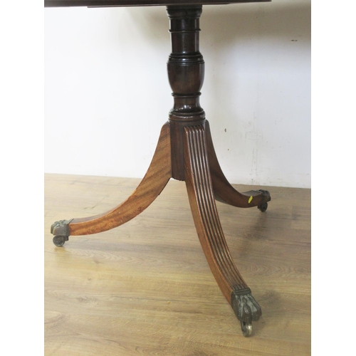 447 - A 19th Century mahogany Twin Pillar Dining Table, the reeded edge rectangular top and leaf raised on... 