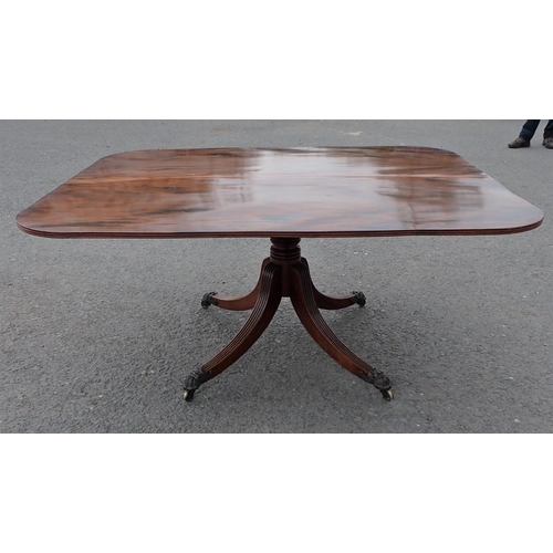 455 - A Regency mahogany Breakfast Table with rounded rectangular top on turned column and quadruple reede... 