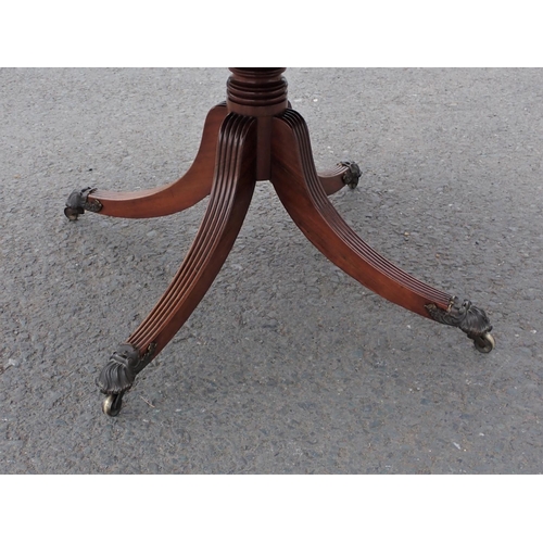 455 - A Regency mahogany Breakfast Table with rounded rectangular top on turned column and quadruple reede... 