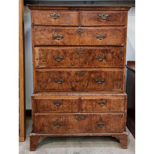 459 - An early 18th Century walnut Chest of two short and three long cross-banded drawers, on stand with t... 