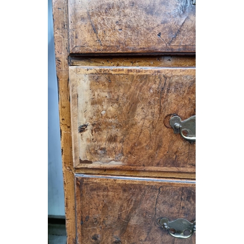 459 - An early 18th Century walnut Chest of two short and three long cross-banded drawers, on stand with t... 