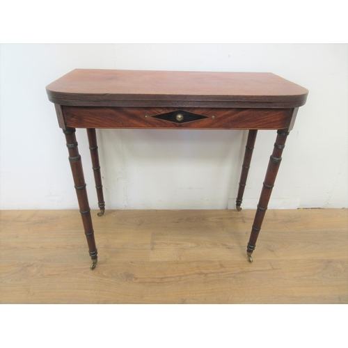 467 - A Regency mahogany Tea Table with reeded D-shape fold-over top above lozenge inlaid frieze on ring-t... 