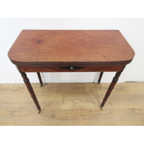 467 - A Regency mahogany Tea Table with reeded D-shape fold-over top above lozenge inlaid frieze on ring-t... 