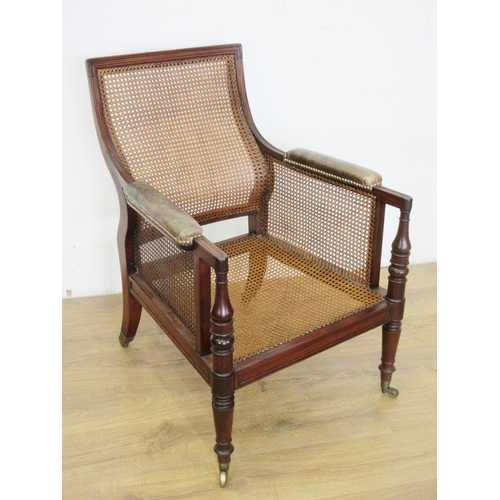 468 - A Regency mahogany Library Bergere Chair, the shaped moulded back and upholstered arms above a deep ... 