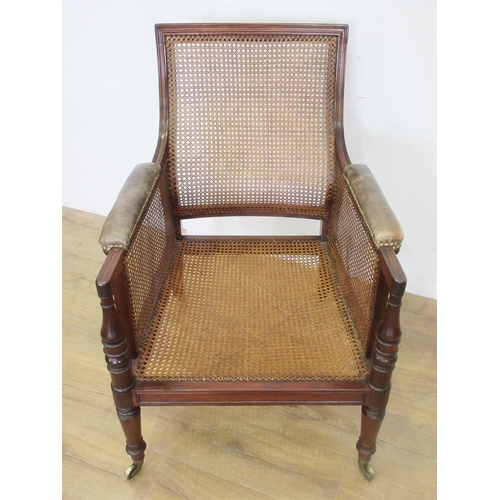 468 - A Regency mahogany Library Bergere Chair, the shaped moulded back and upholstered arms above a deep ... 