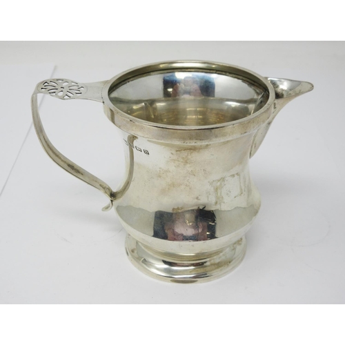 47 - A George V silver Jug with pierced flat section handle, Birmingham 1926