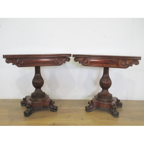 470 - A pair of 19th Century carved mahogany Card Tables, the foldover tops above shaped friezes on moulde... 