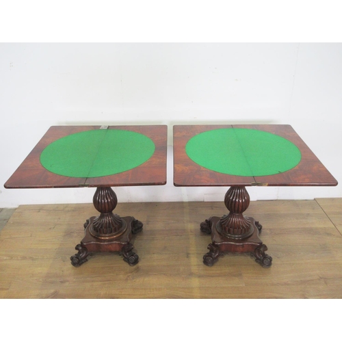 470 - A pair of 19th Century carved mahogany Card Tables, the foldover tops above shaped friezes on moulde... 