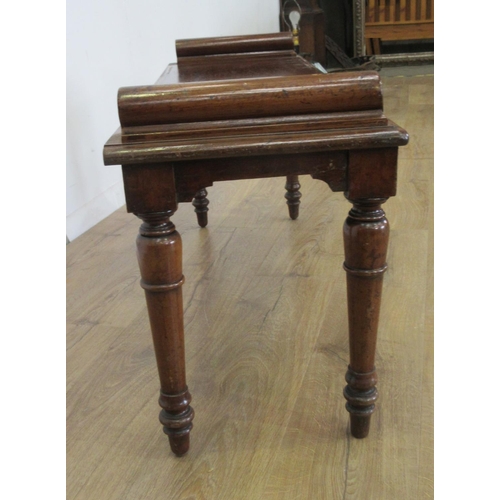 471 - A 19th Century mahogany Hall Bench with moulded blocks above a rectangular seat raised on taper turn... 