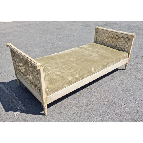 472 - A French style painted Daybed with double caned head and footboard, scrolled ends with carved patter... 