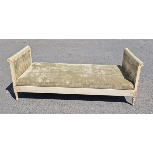 472 - A French style painted Daybed with double caned head and footboard, scrolled ends with carved patter... 