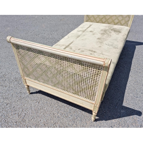 472 - A French style painted Daybed with double caned head and footboard, scrolled ends with carved patter... 