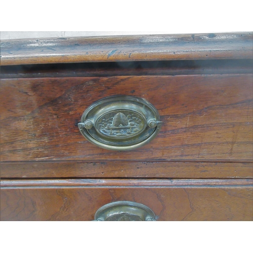 475 - A 19th Century elm Chest of four long drawers with quarter round pilasters and raised on bracket sup... 