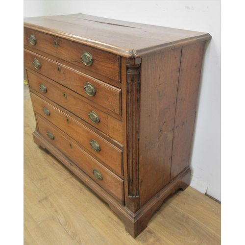 475 - A 19th Century elm Chest of four long drawers with quarter round pilasters and raised on bracket sup... 